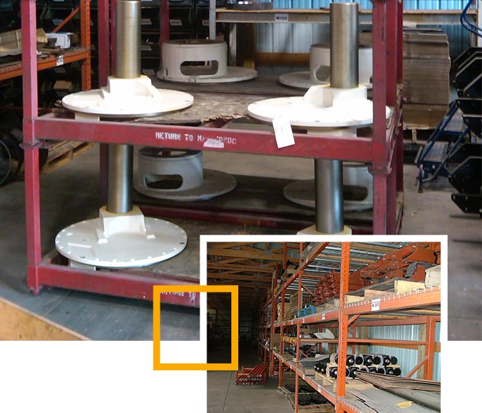 Shelves with inventory of large machine parts