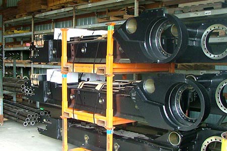 Large machine parts on a shelf